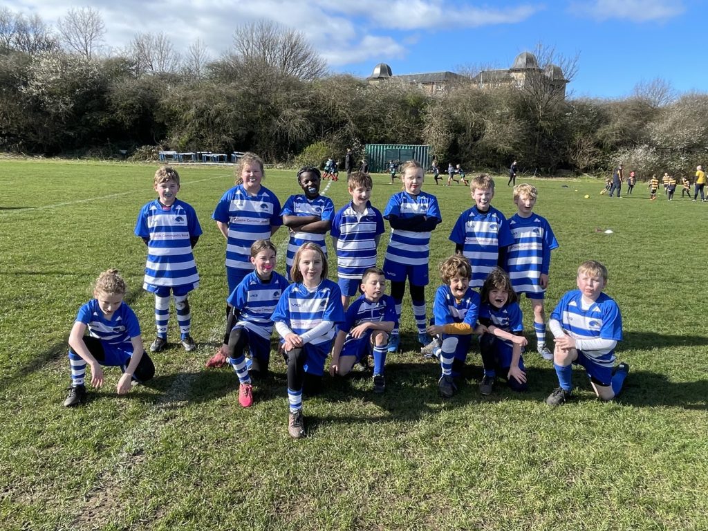 Team photo of Leith Hawks players with blue and white stripe shirts